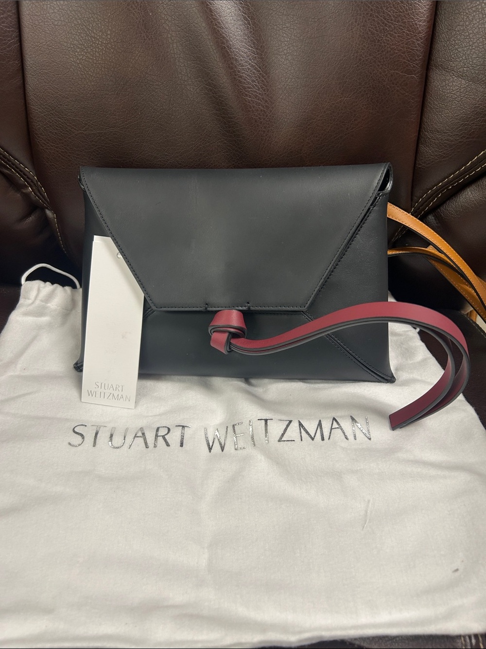 Stuart Weitzman Black Leather Envelope Crossbody with Burgundy Strap Accent